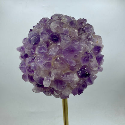 Amethyst in bronze and onyx base