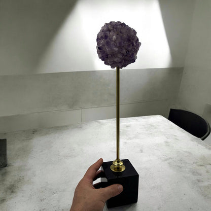 Amethyst in bronze and onyx base